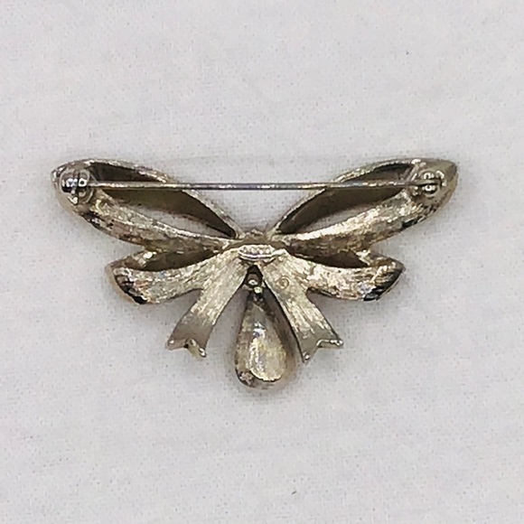 VINTAGE Avon Brooch Birthday Bow Faux Ruby Birthstone Silver Tone Rhin… - Picture 6 of 7
